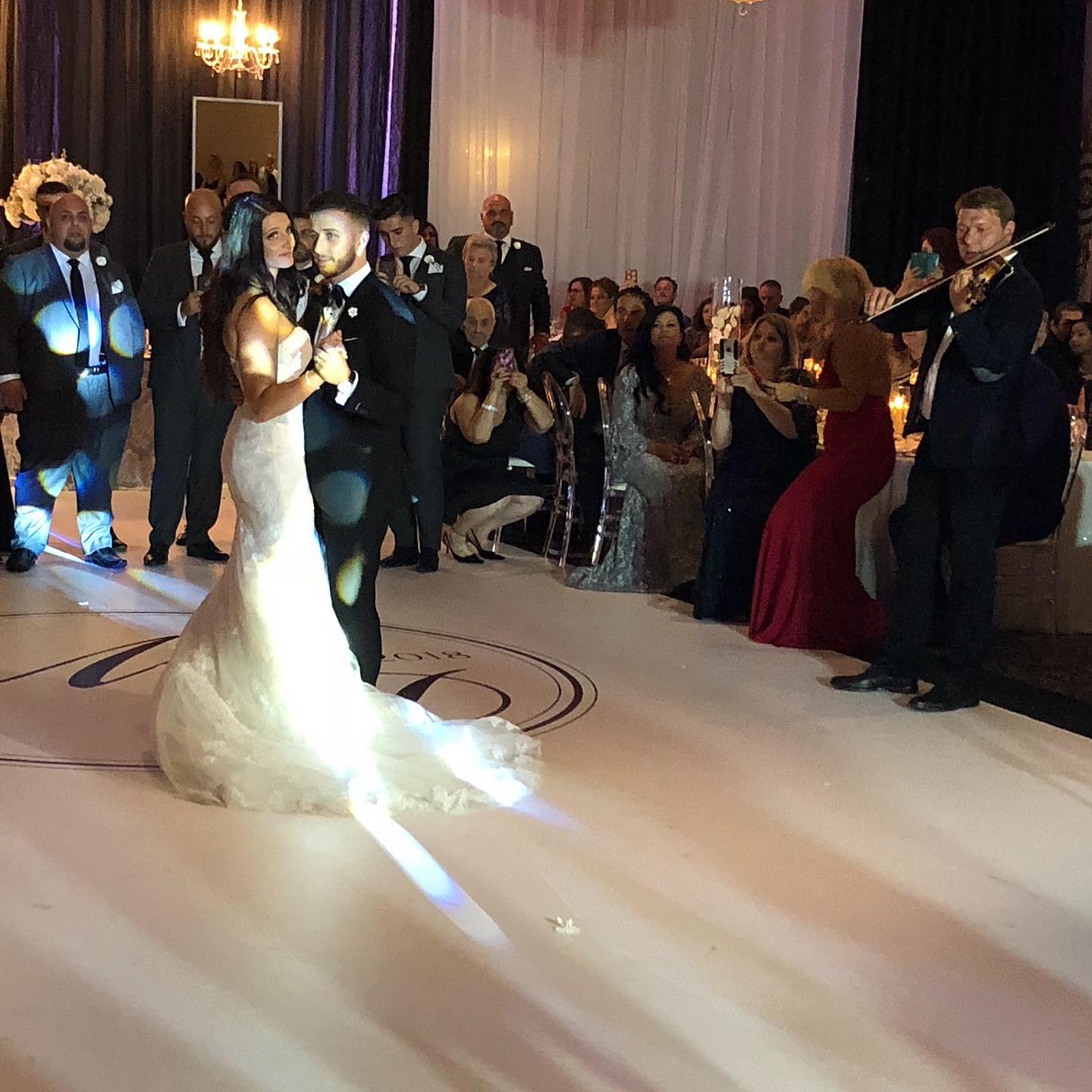 Wedding dance floor with live violin performance