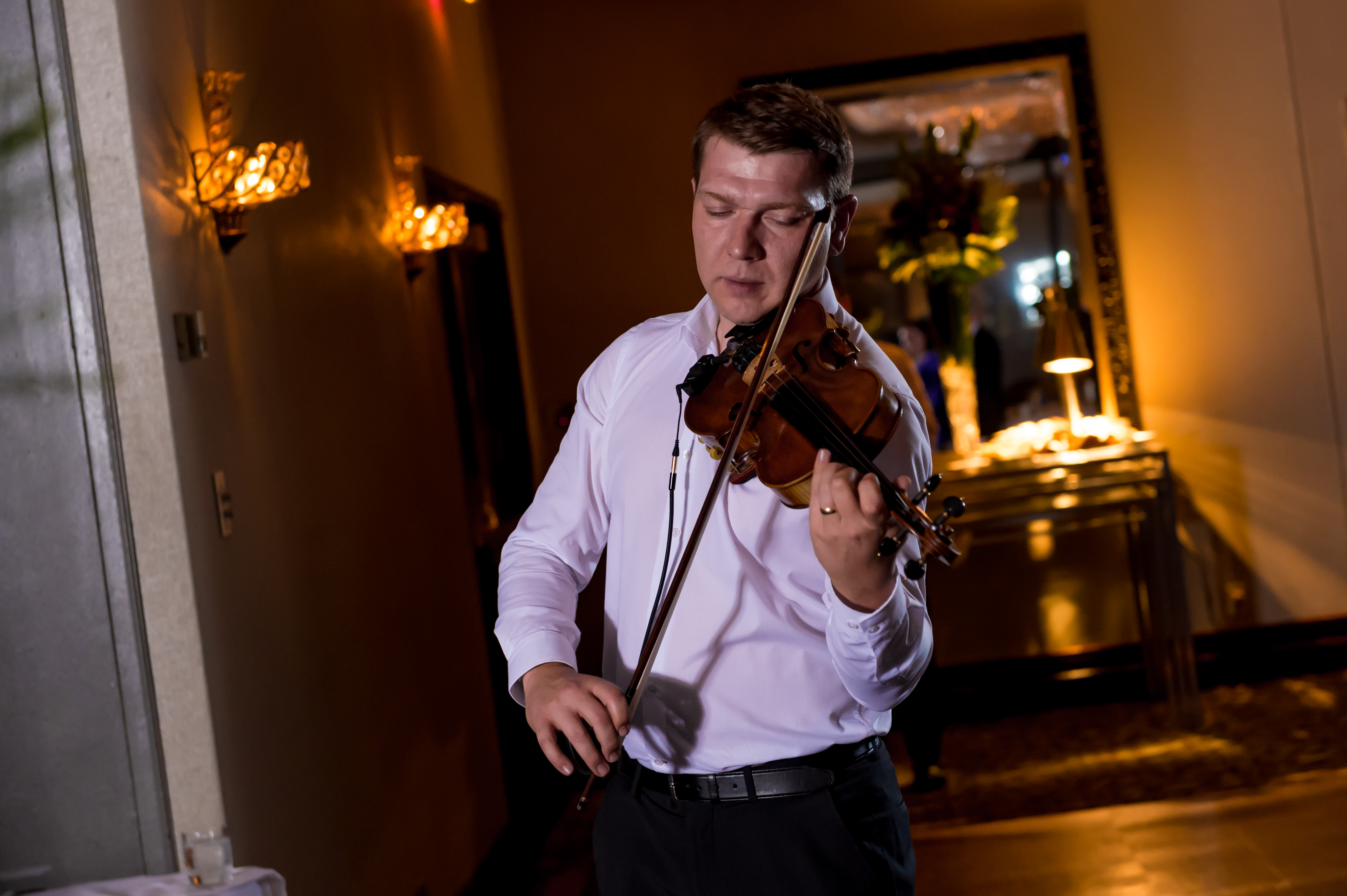 Mihai performing live violin at an event